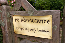 Bilbo Baggins' gate with a paper sign reading no admittance except on party business