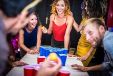 young-friends-playing-beer-pong-at-youth-hostel-2022-12-09-04-46-11-utc.jpg